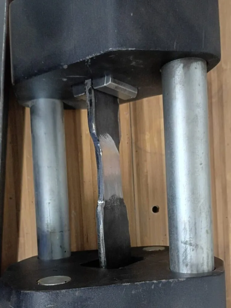 Close-up of a completed multi-pass weld seam on structural steel.